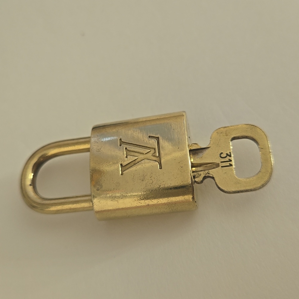 *Authentic* Louis Vuitton Lock number 311